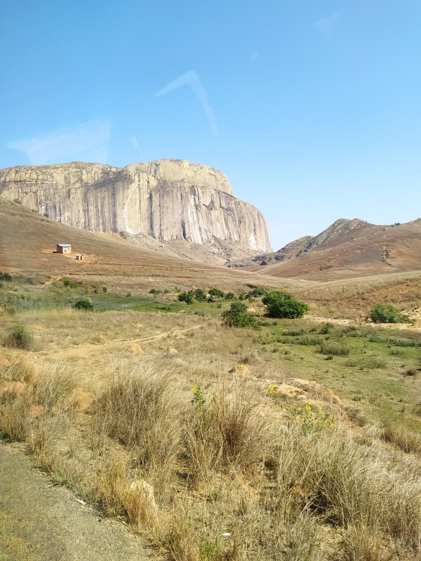 Madagascar highland landscape with dry grassland and limestone cliffs